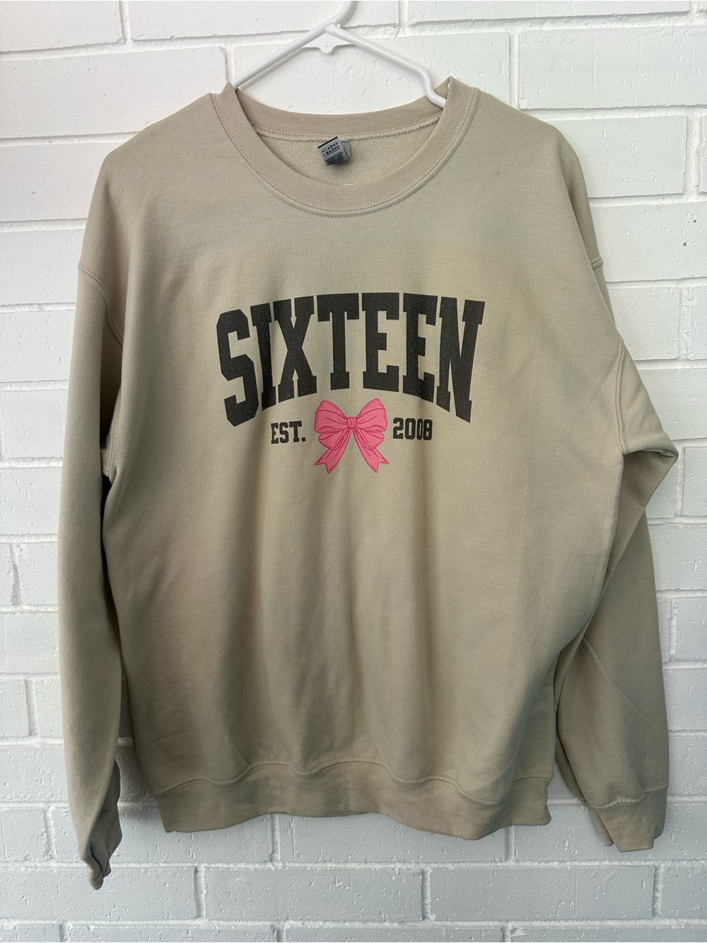 Sixteen Birthday Tan Crewneck Sweatshirt with Pink Bow Graphic